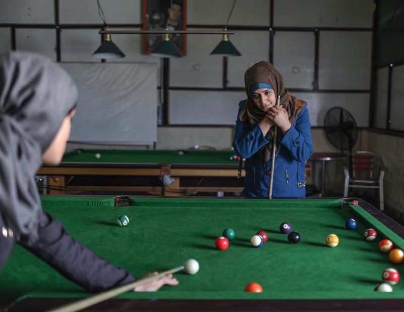 Everyday Middle East aims to challenge stereotypes often associated with the region. In this picture Palestinian girls play billiards inside a women's cafe in Gaza City. 