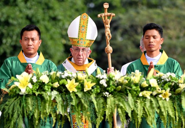 Pope Francis arrives to lead the Mass in Yangon.