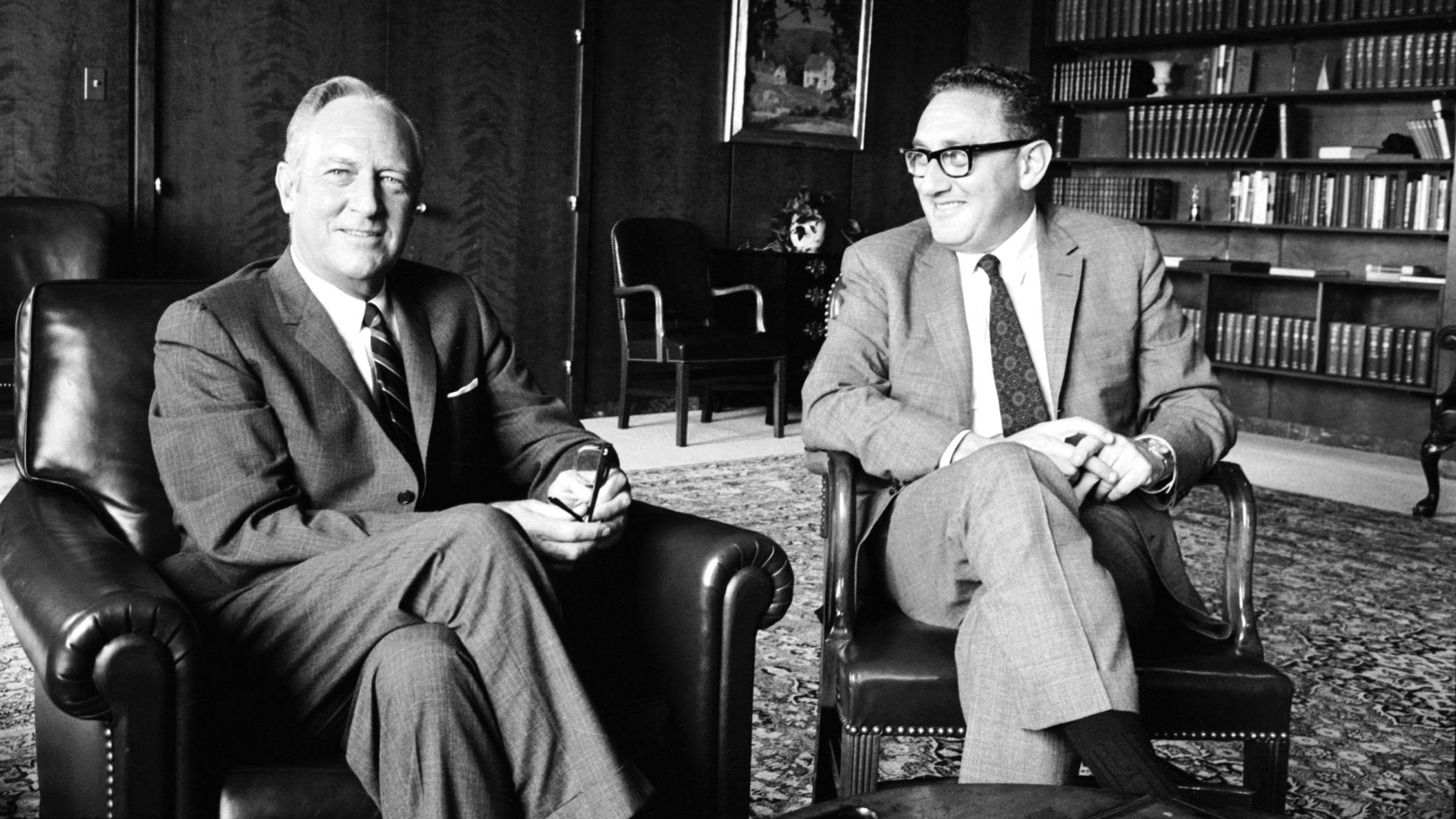 Kissinger, as US national security adviser, sits with US Secretary of State William P. Rogers in 1969. Earlier in the 1960s, Kissinger was a consultant for the National Security Council, the US Arms Control and Disarmament Agency and the State Department.