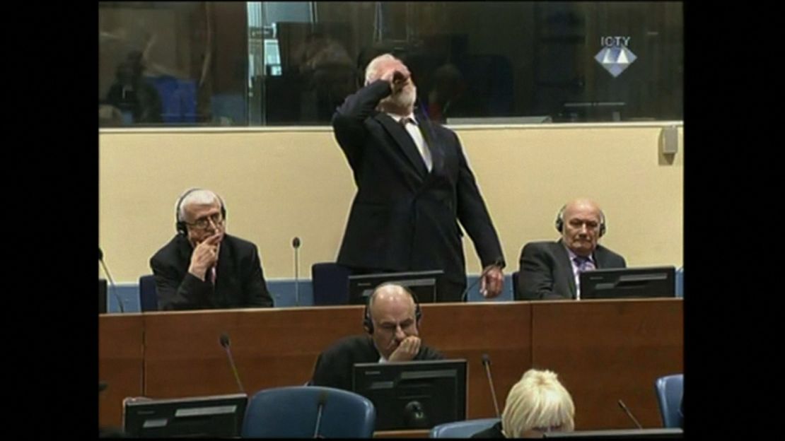 Slobodan Praljak drinks the contents of a small vial in a Hague courtroom on Wednesday.