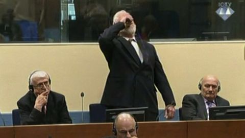 Slobodan Praljak drinks the contents of a small vial in a Hague courtroom on Wednesday.