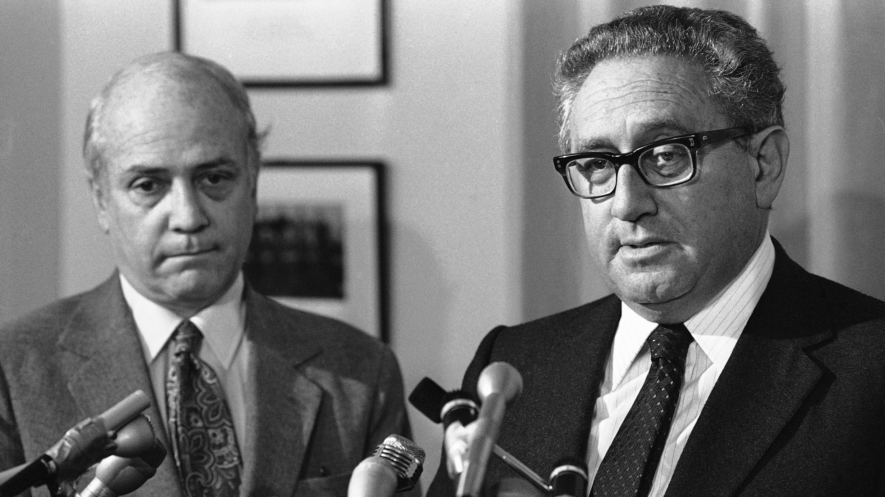 Kissinger speaks to reporters at a hospital in Boston, where he announced that he would undergo triple bypass heart surgery in 1982.