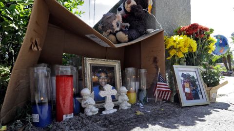 A makeshift memorial for shooting victim Anthony Naiboa sits on a sidewalk in the Seminole Heights neighborhood of Tampa on October 24.