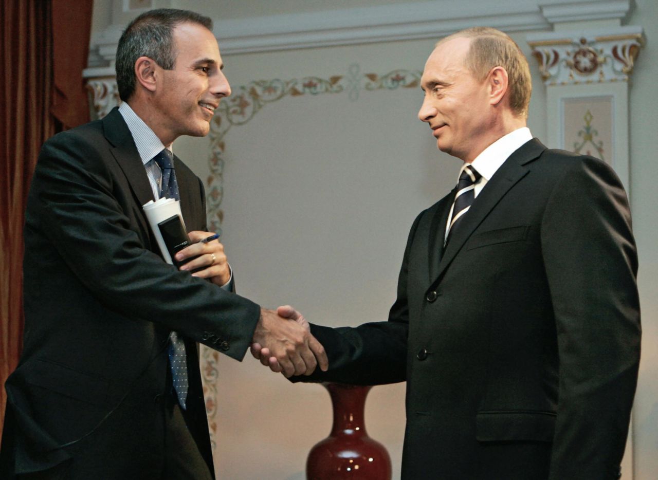 Lauer shakes hands with Russian President Vladimir Putin in Moscow, in July 2006.