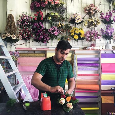 In this picture a florist in Erbil, Iraq, gets a bouquet ready for a client.