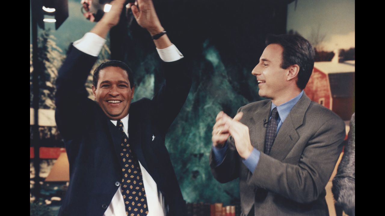 Hosts Bryant Gumbel and Lauer cheer together during Gumbel's last appearance on the "Today" show in 1997.