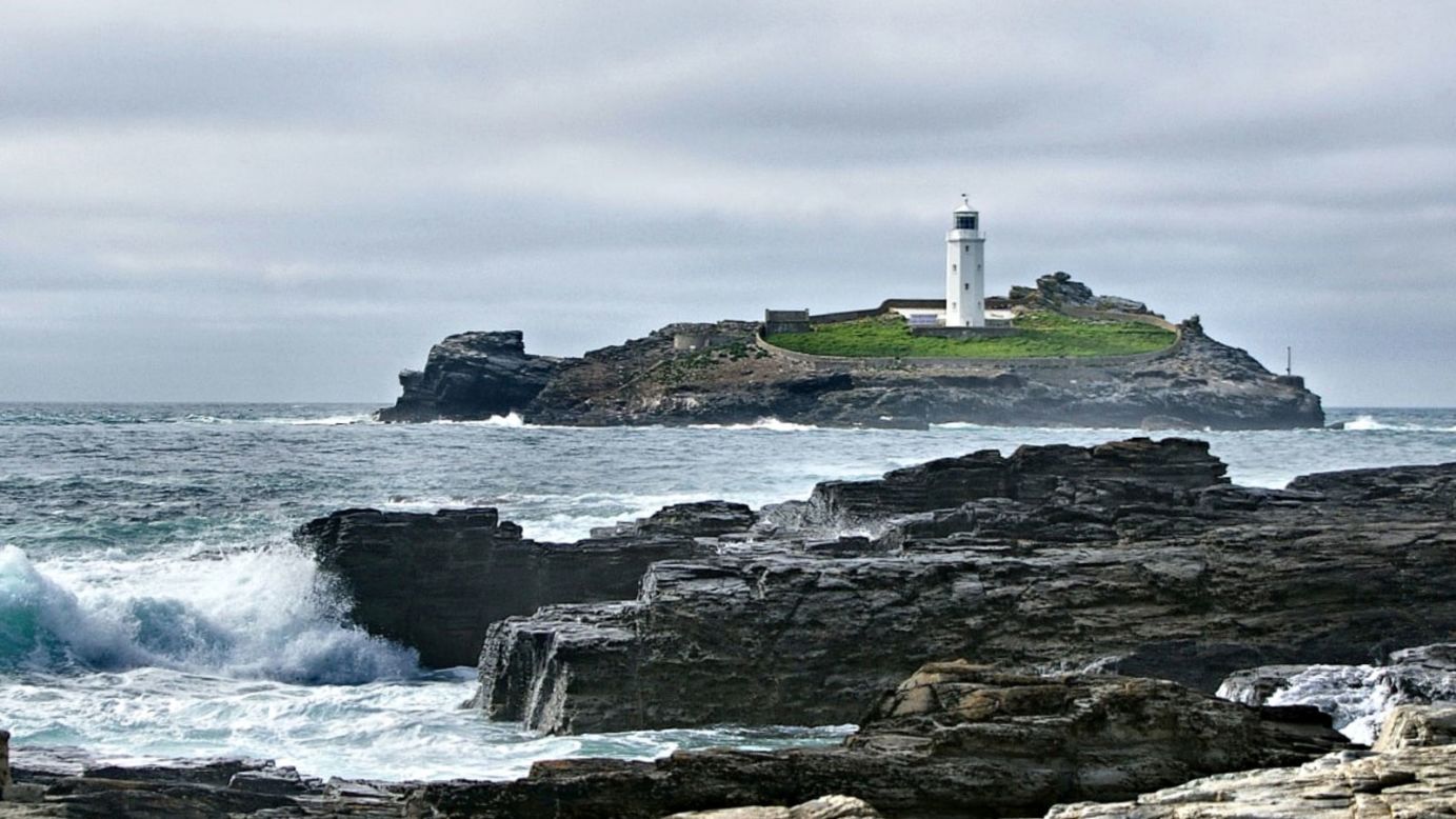<strong>Godrevy, Cornwall: </strong>The white lighthouse on Godrevy Island, which sits at the tip of the bay, was the inspiration for Virginia Woolf's novel "To The Lighthouse." Binoculars are a good idea here as seabirds and birds of prey, including Merlin, are easily spotted.