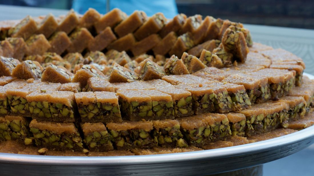 <strong>Pistachios in pastry:</strong> Running through the heart of Amman, King Hussein Street is lined with some of the city's most beloved pastry shops. Here, a tender layer of pastry tops bright green pistachios, which have been grown in the Middle East for thousands of years.<br />
