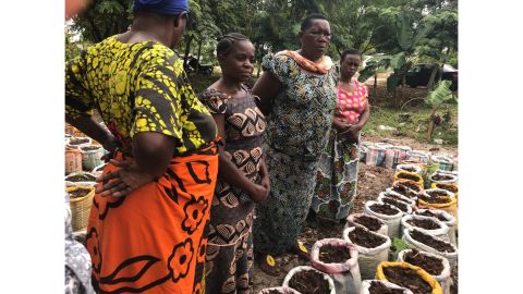 Women in the Kipunguni program stand in their community garden.