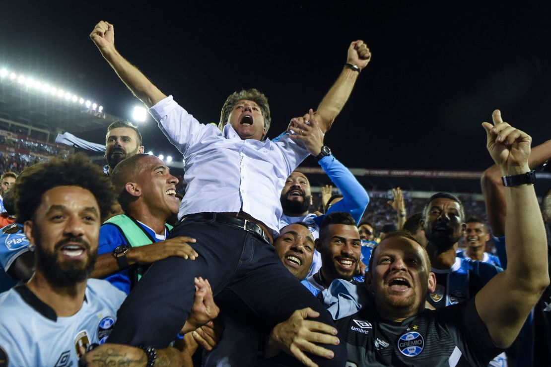 Renato Gaucho is held aloft by his players after guiding the to Libertadores glory.