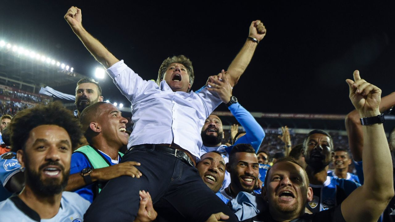Renato Gaucho is held aloft by his players after guiding the to Libertadores glory.