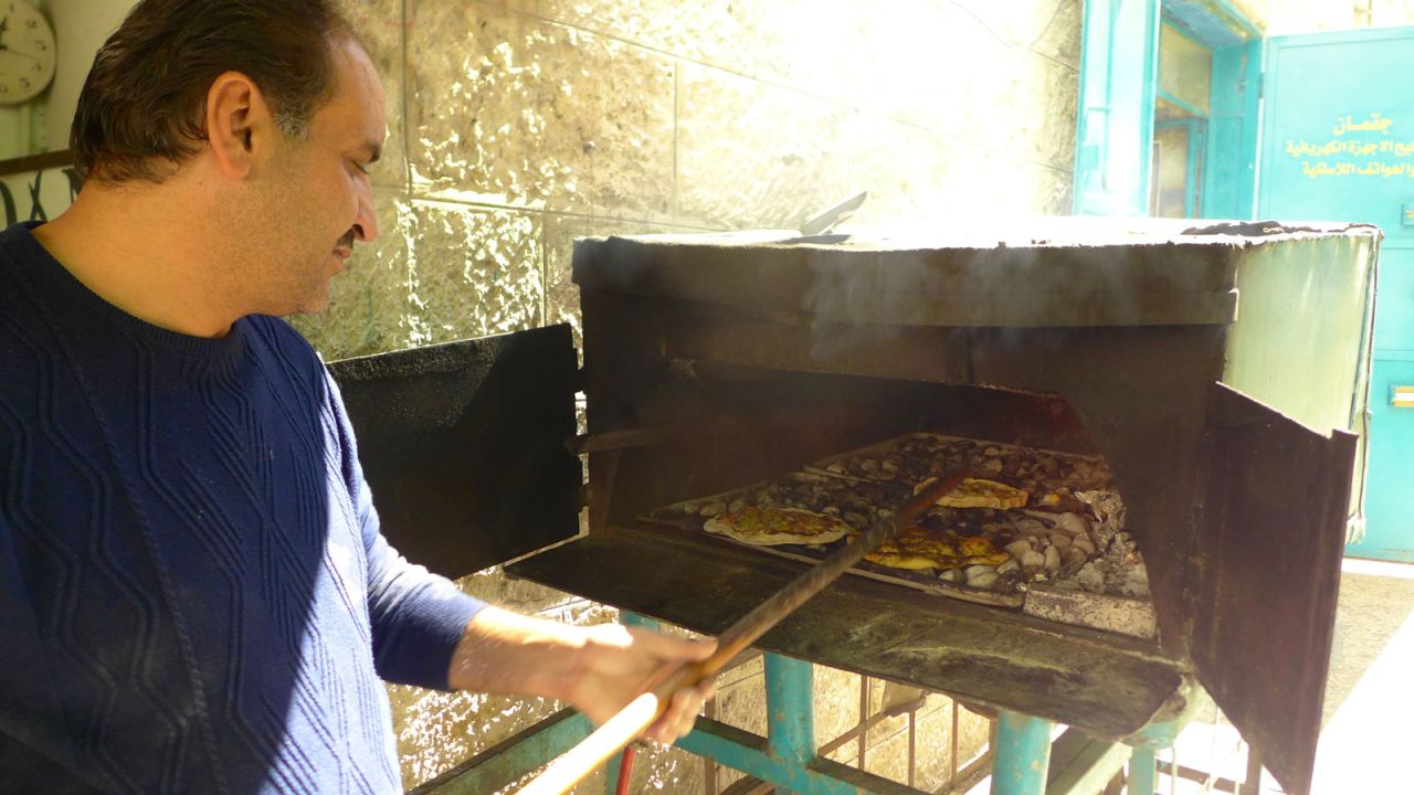Abu Issa street kitchen offers Palestinian pizza baked fresh in a makeshift oven. 