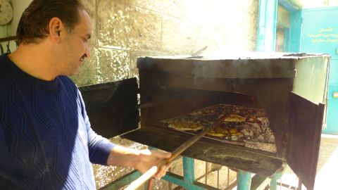 Abu Issa street kitchen offers Palestinian pizza baked fresh in a makeshift oven. 