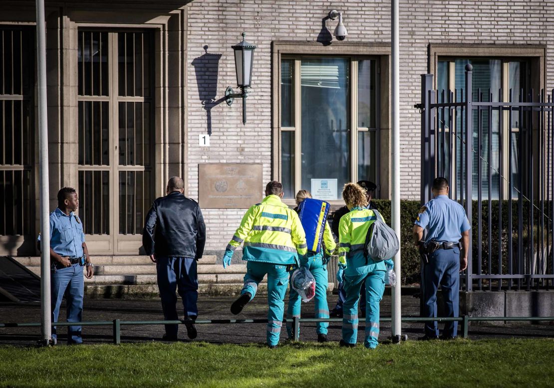 Emergency services personnel head toward the tribunal building in The Hague on Wednesday.