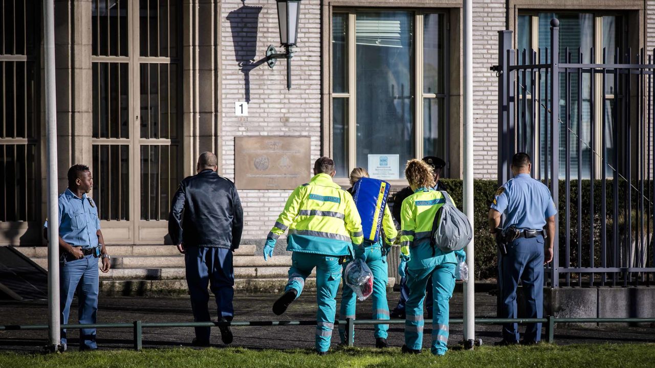 Emergency services personnel head toward the tribunal building in The Hague on Wednesday.