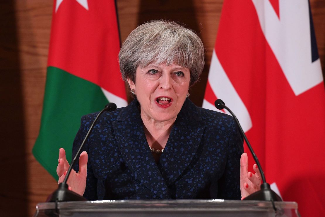 Theresa May addresses guests and media during a speech in Amman, Jordan