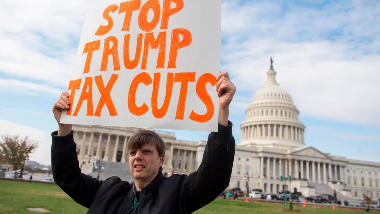Demonstrators protest against the Republican tax reform plan during a rally organized by Our Revolution and Americans for Tax Fairness Action Fund on Capitol Hill in Washington, DC, November 15, 2017.