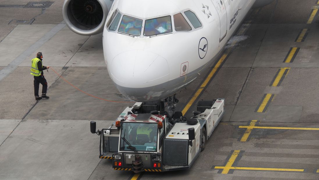 <strong>Pushback: </strong>Closer to departure, an aircraft tug will park right in front of the nose wheel. The tug might be directly attached to the plane's nose gear with a tow bar, or could be a "wheel-lift" tug. These tugs cradle the nose gear, then lift it up before moving the plane. That gives the tug driver control over the plane's direction during pushback.
