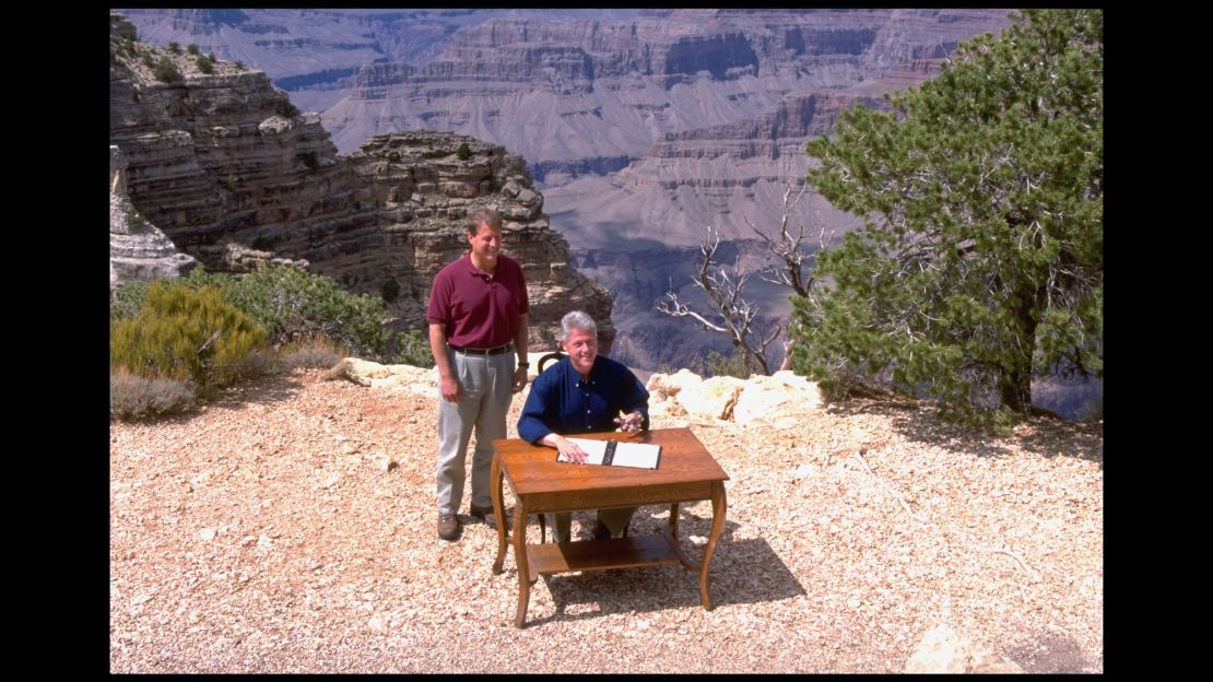 President Bill Clinton and Vice President Al Gore pose at the edge of the Grand Canyon, during the signing of a proclamation establishing Utah's Grand Staircase-Escalante National Monument.