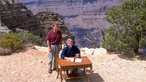President Bill Clinton and Vice President Al Gore pose at the edge of the Grand Canyon, during the signing of a proclamation establishing Utah's Grand Staircase-Escalante National Monument.