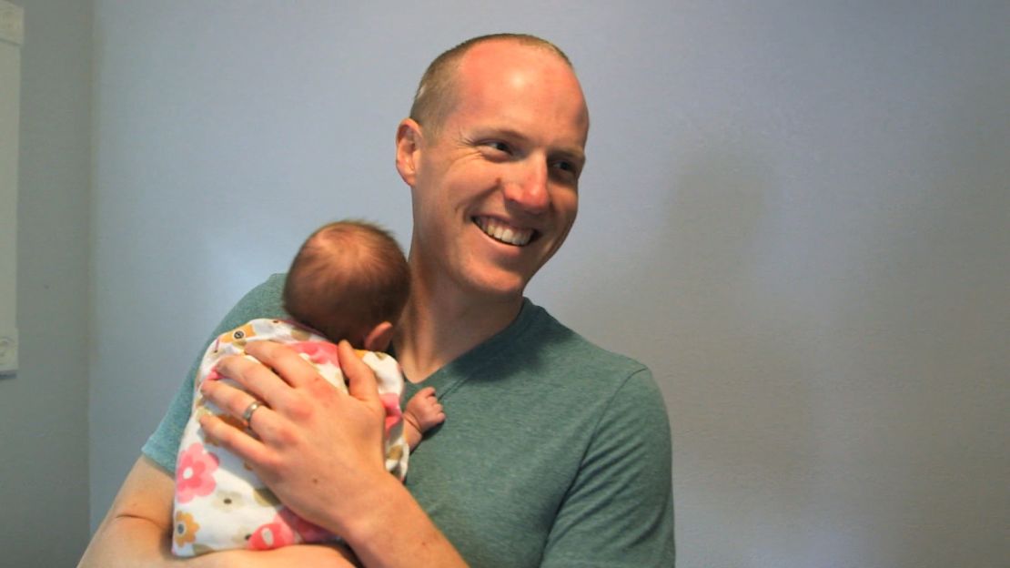 Officer Holets adopts baby