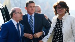Former Trump national security adviser Michael Flynn, center, arrives at federal court in Washington, Friday, Dec. 1, 2017. Court documents show Flynn, an early and vocal supporter on the campaign trail of President Donald Trump whose business dealings and foreign interactions made him a central focus of Mueller's investigation, w