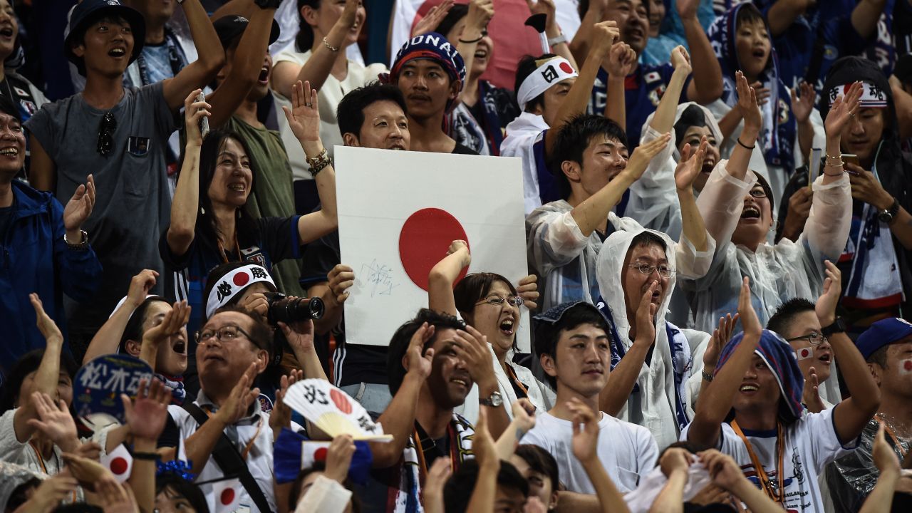 Japanese fans rejoice after Genki Haraguchi scored the first goal in Japan's 2-0 victory over Thailand during the 2018 FIFA World Cup qualifying football match between Thailand and Japan in Bangkok on September 6, 2016. / AFP / LILLIAN SUWANRUMPHA        (Photo credit should read LILLIAN SUWANRUMPHA/AFP/Getty Images)