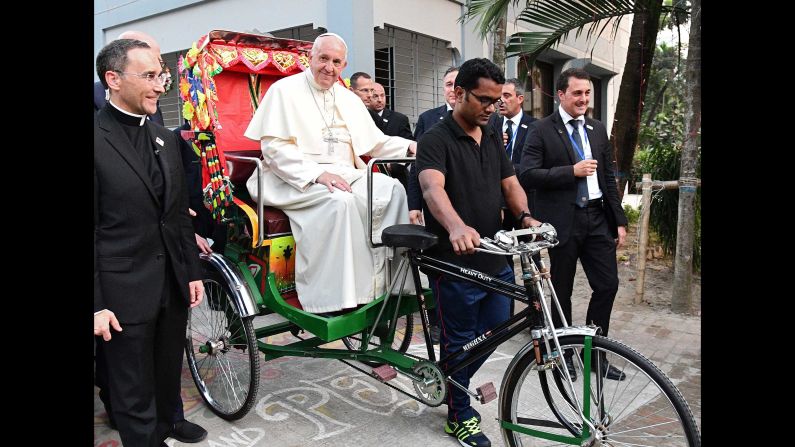 Pope Francis takes a ride in a rickshaw in Dhaka on December 1.