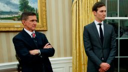 National Security Adviser Michael Flynn, left, Senior Adviser to President Donald Trump Jared Kushner, center, and Vice President Mike Pence watch as Trump signs his first executive order in the Oval Office of the White House, Friday, Jan. 20, 2017, in Washington. (AP Photo/Evan Vucci)