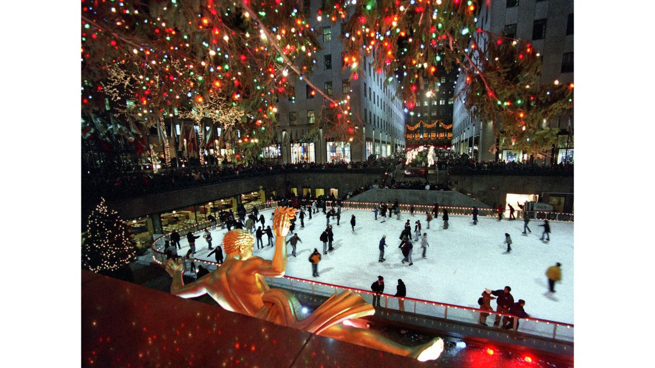 <strong>1999:</strong> Ice skaters make the rounds  framed by the statue of Prometheus and the center's 100-foot Norway spruce.