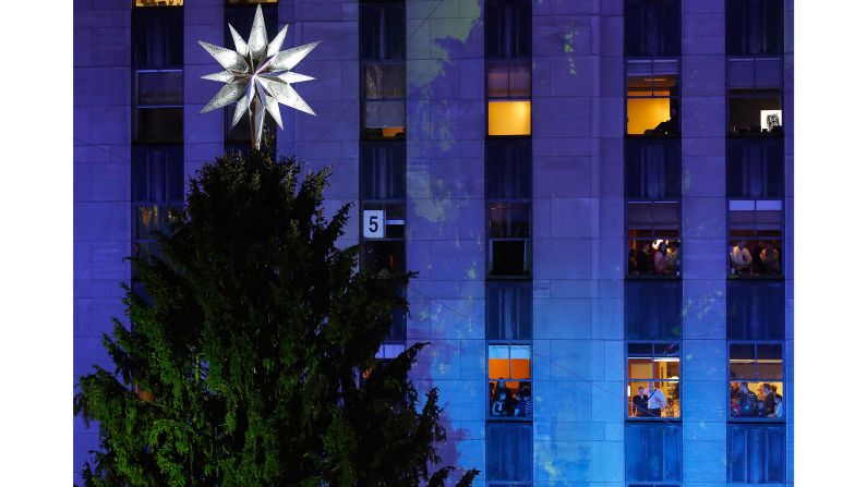 <strong>2013:</strong> Spectators in buildings overlooking Rockefeller Center watch the festivities.