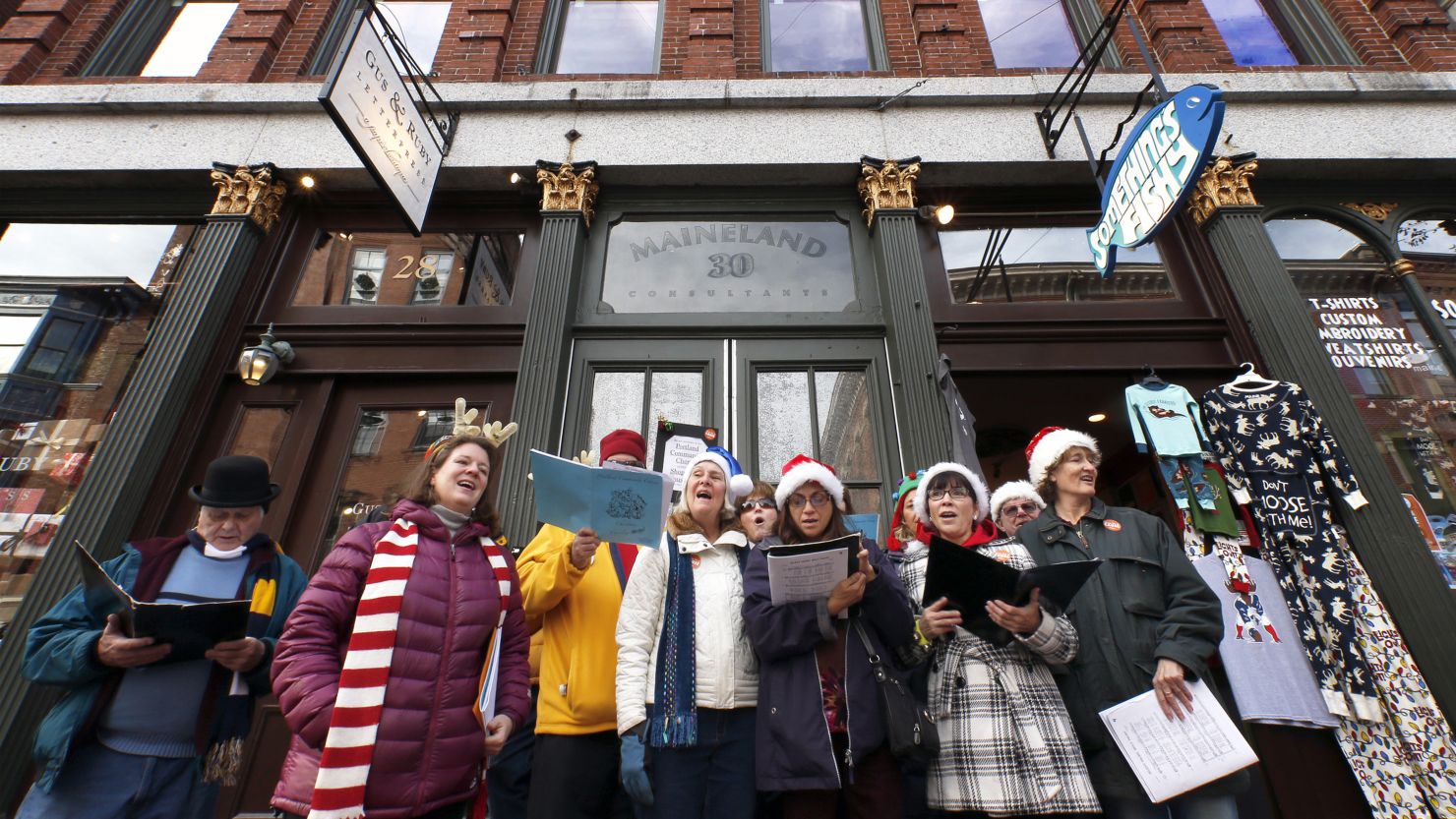 Members of the Portland Community Chorus sing holiday carols in downtown Portland, Maine.