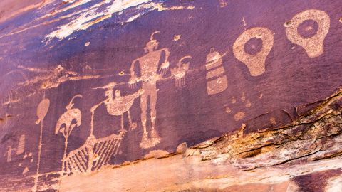 Ancient rock art is pockmarked by bullets from when Mormons headed through Bears Ears in Utah. 