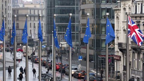 Flags flap in the wind outside the EU headquarters in Brussels on Monday.