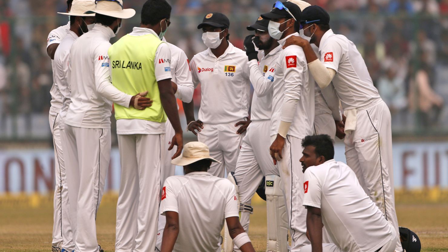 Sri Lanka's cricket team wears anti-pollution masks as they play the second day of their third test match in New Delhi, on Sunday December 3. 

