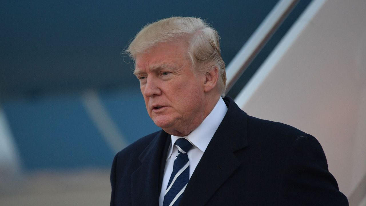 US President Donald Trump steps off Air Force One upon arrival at Andrews Air Force Base in Maryland on December 2, 2017. 
Trump is returning to Washington, DC after attending fundraisers in New York, New York.