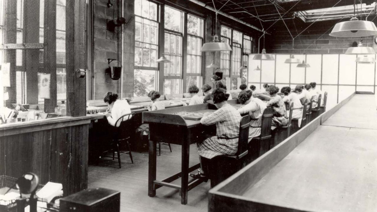 Radium Girls work in a factory owned by the United States Radium Corporation, circa 1922