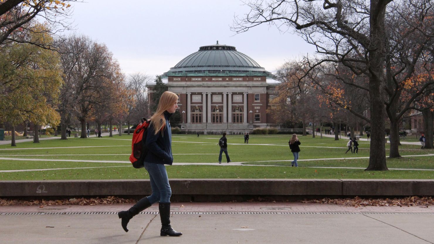  In this Nov. 20, 2015 photo, University of Illinois students walk across the Main Quad on campus in Urbana, Illinois.