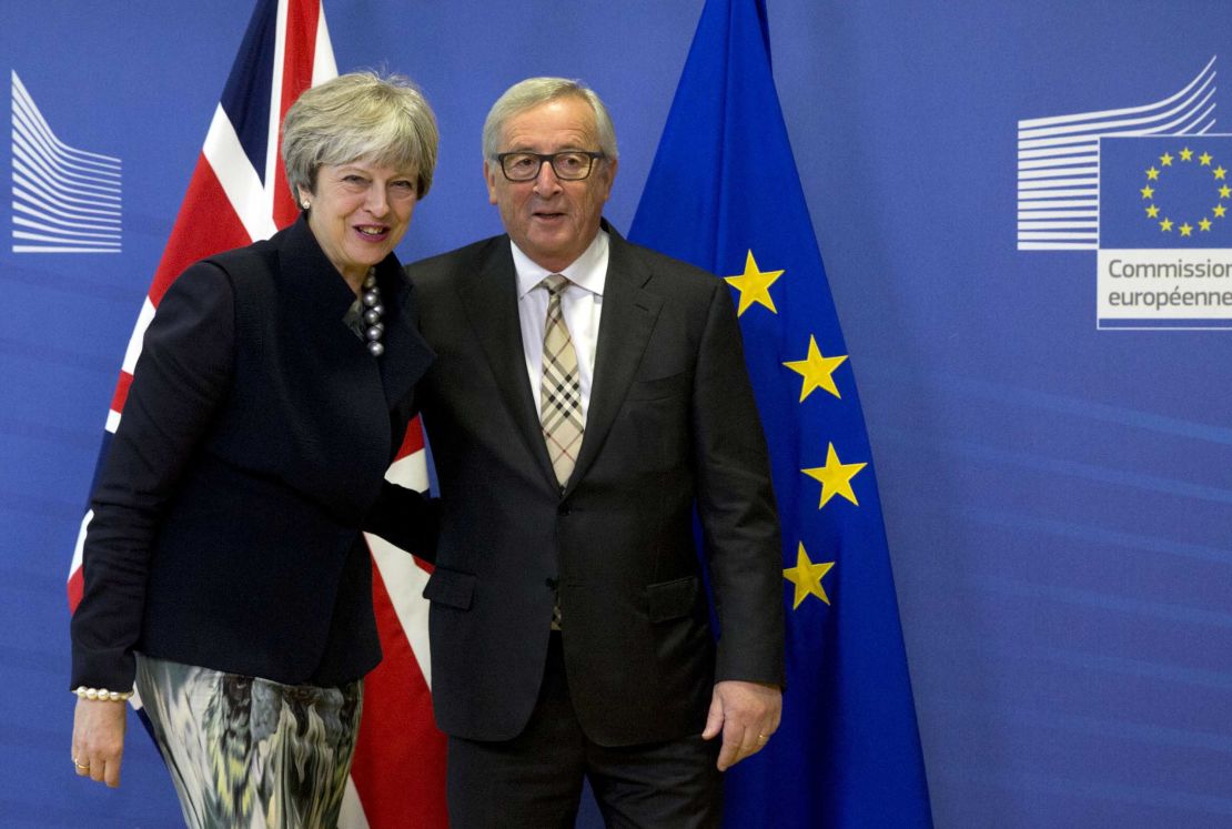 European Commission President Jean-Claude Juncker greets British PM Theresa May prior to a crucial Brexit meeting at EU headquarters in Brussels on Monday.