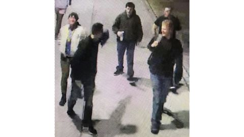 Campus police at Southern Methodist University are asking for the public's help in identifying the five men, seen here in an image from surveillance footage, who posted the flyers over the weekend.