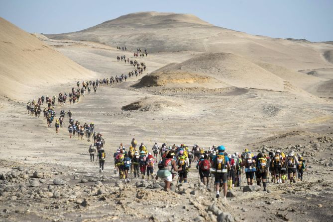 Competitors travel through the Ica desert during Peru's Marathon des Sables on Thursday, November 30. The ultramarathon is divided into six stages and is approximately 250 kilometers (155.34 miles) long.
