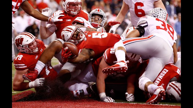 Wisconsin running back Chris James reaches over the pile for a touchdown during the Big Ten Championship on Saturday, December 2. The fourth-quarter score moved the Badgers closer to Ohio State, but they ultimately lost 27-21. It was their first loss of the season.