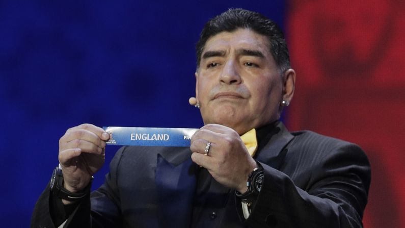 Argentine soccer legend Diego Maradona holds up England's name during <a href="index.php?page=&url=http%3A%2F%2Fwww.cnn.com%2F2017%2F12%2F01%2Ffootball%2Fworld-cup-draw-russia-football-putin%2Findex.html" target="_blank">the World Cup draw</a> in Moscow on Friday, December 1. Maradona, of course, scored two of his most famous goals against the English, knocking them out of the 1986 World Cup. 
