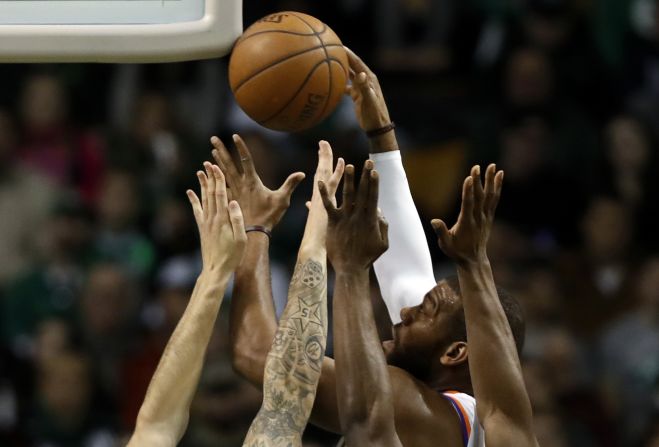 Phoenix center Greg Monroe rises above a crowd during an NBA game in Boston on Saturday, December 2.