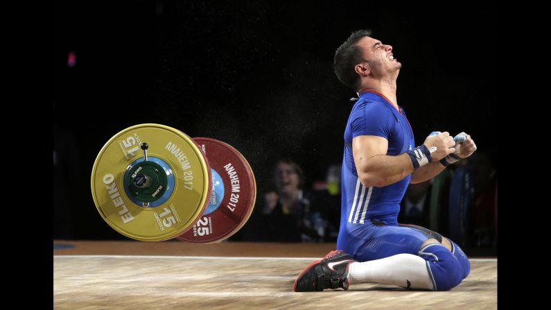 French weightlifter Romain Jordan Sebastian Imadouchine reacts during the Weightlifting World Championships on Sunday, December 3. He won bronze in his weight class' clean-and-jerk category.