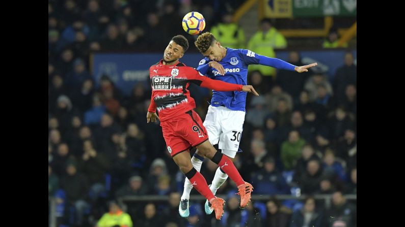 Huddersfield Town's Elias Kachunga, left, and Everton's Mason Holgate jump for<br />a header during a Premier League match in Liverpool, England, on Saturday, December 2.