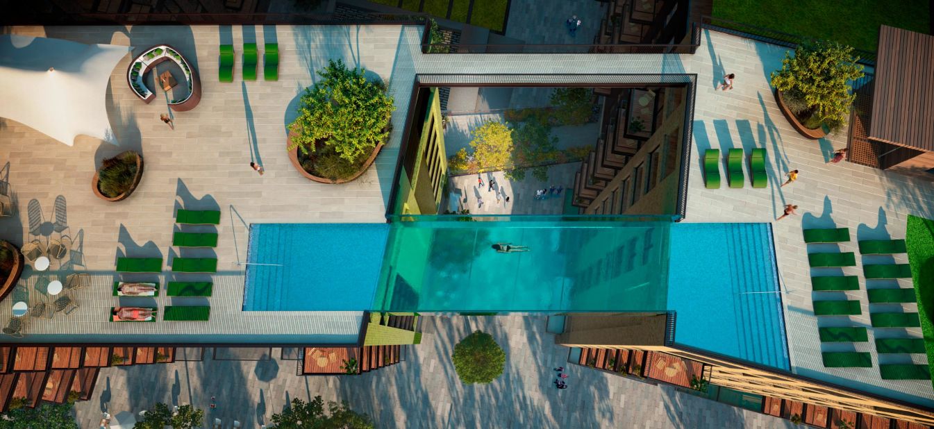 A new quarter being built next door to London's Battersea Power Station will feature a suspended, glass-bottomed pool between two of the residential blocks. 