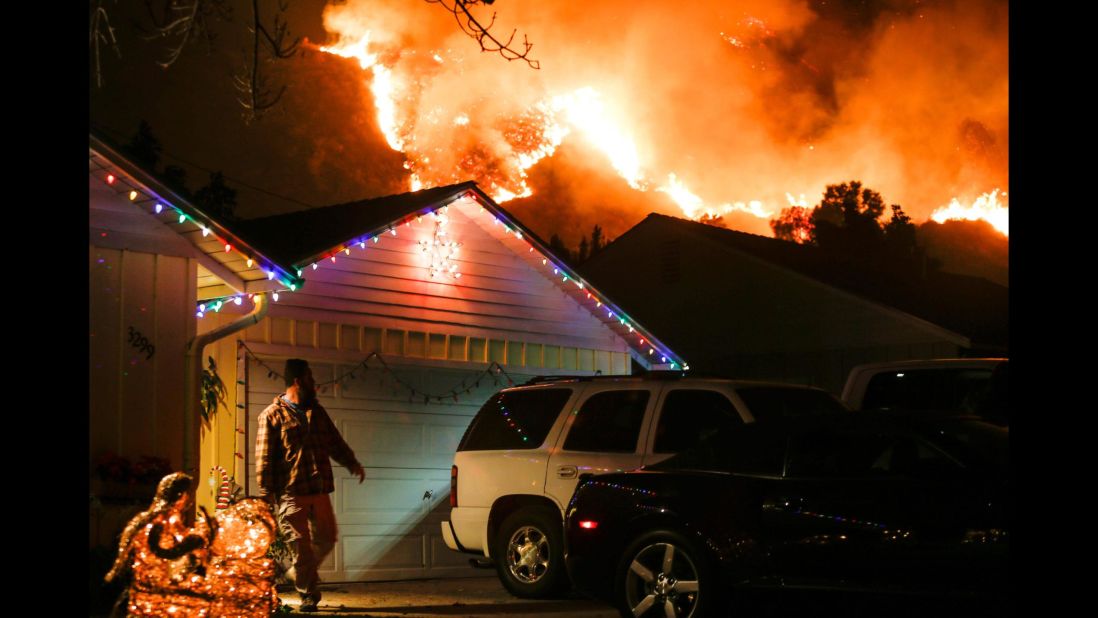 A man prepares to evacuate his house in Santa Paula, California, on December 5.