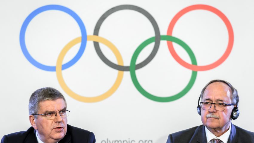 International Olympic Committee (IOC) President Thomas Bach (L) and Chair of IOC Inquiry Commission into alleged Russian doping at Sochi 2014 Swiss Samuel Schmid attend a press conference following an executive meeting on Russian doping, on December 5, 2017 in Lausanne.
Russia were banned from the 2018 Olympics on December 5 over state-sponsored doping but the International Olympic Committee said Russian competitors would be able to compete "under strict conditions". / AFP PHOTO / Fabrice COFFRINI (Photo credit should read FABRICE COFFRINI/AFP/Getty Images)