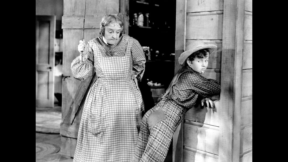 Spanking was a common theme in pop culture. In Mark Twain's classic "The Adventures of Tom Sawyer," Aunt Polly, played in the 1938 movie by May Robson, frequently punishes Tom, played by Tommy Kelly, for playing hooky and other mischief. 